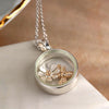 Silver plated circle necklace with golden bee and flower