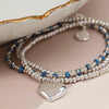 Silver plated and blue bead bracelet with heart charm