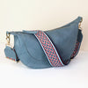 Denim blue Vegan Leather half moon bag with zig-zag strap