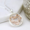 Circle necklace with rose gold hearts and crystals
